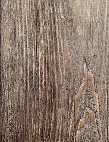 Before and after images of wood restoration work.