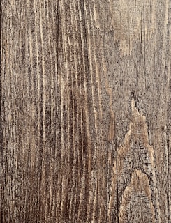 Before and after images of wood restoration work.