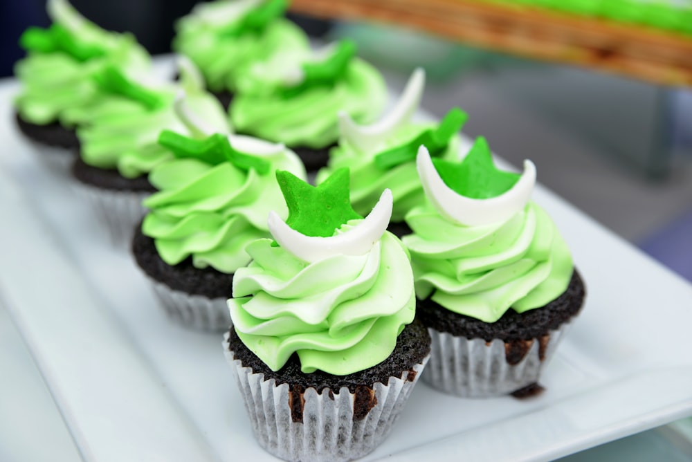 green and black cupcake on white ceramic plate