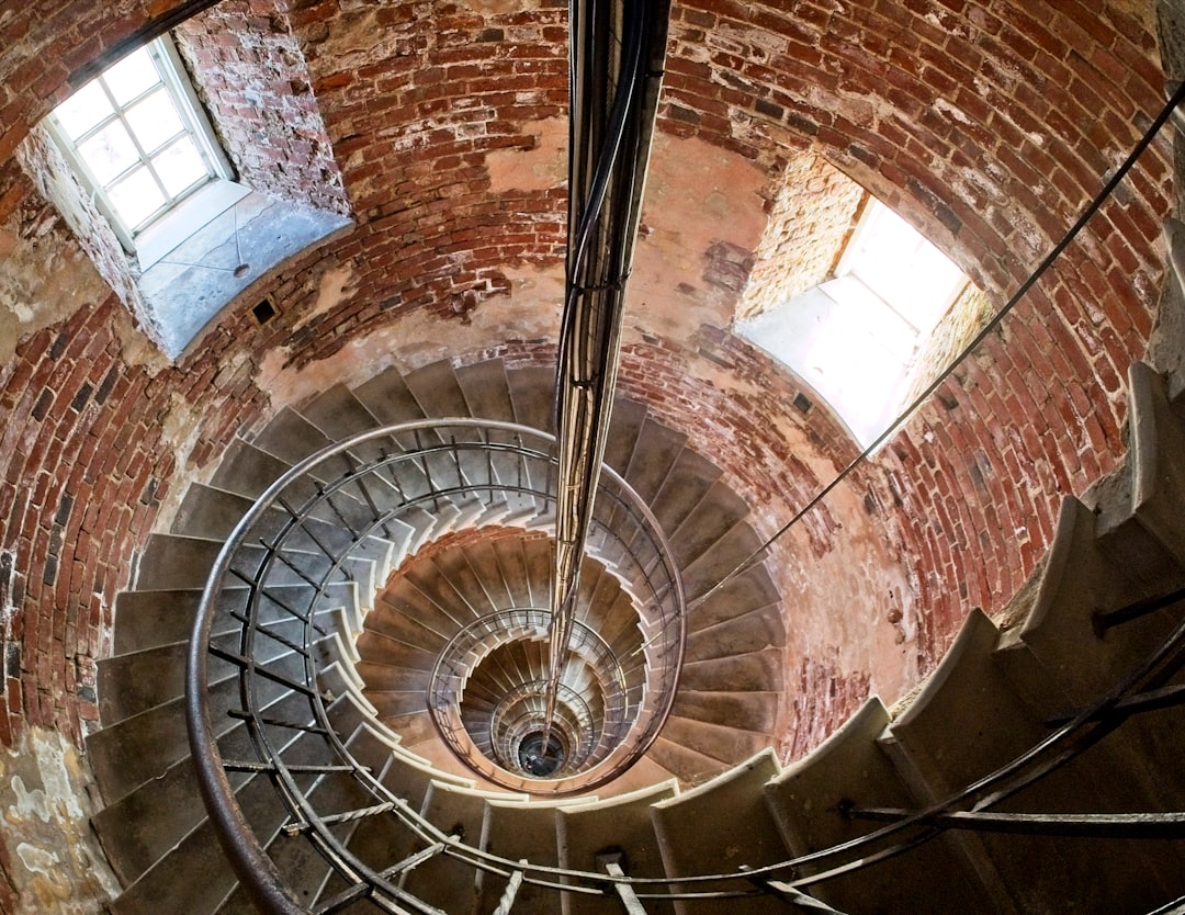 brown and white concrete spiral staircase