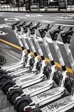 white and black skateboard on black asphalt road