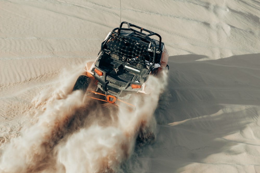 black and white car on white sand