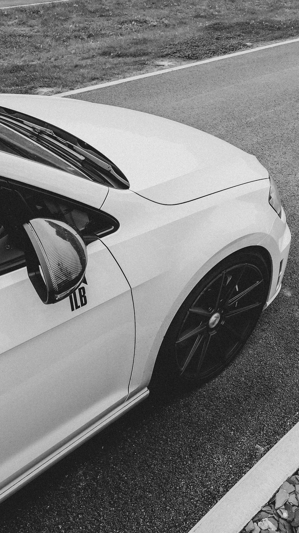 white car on gray asphalt road