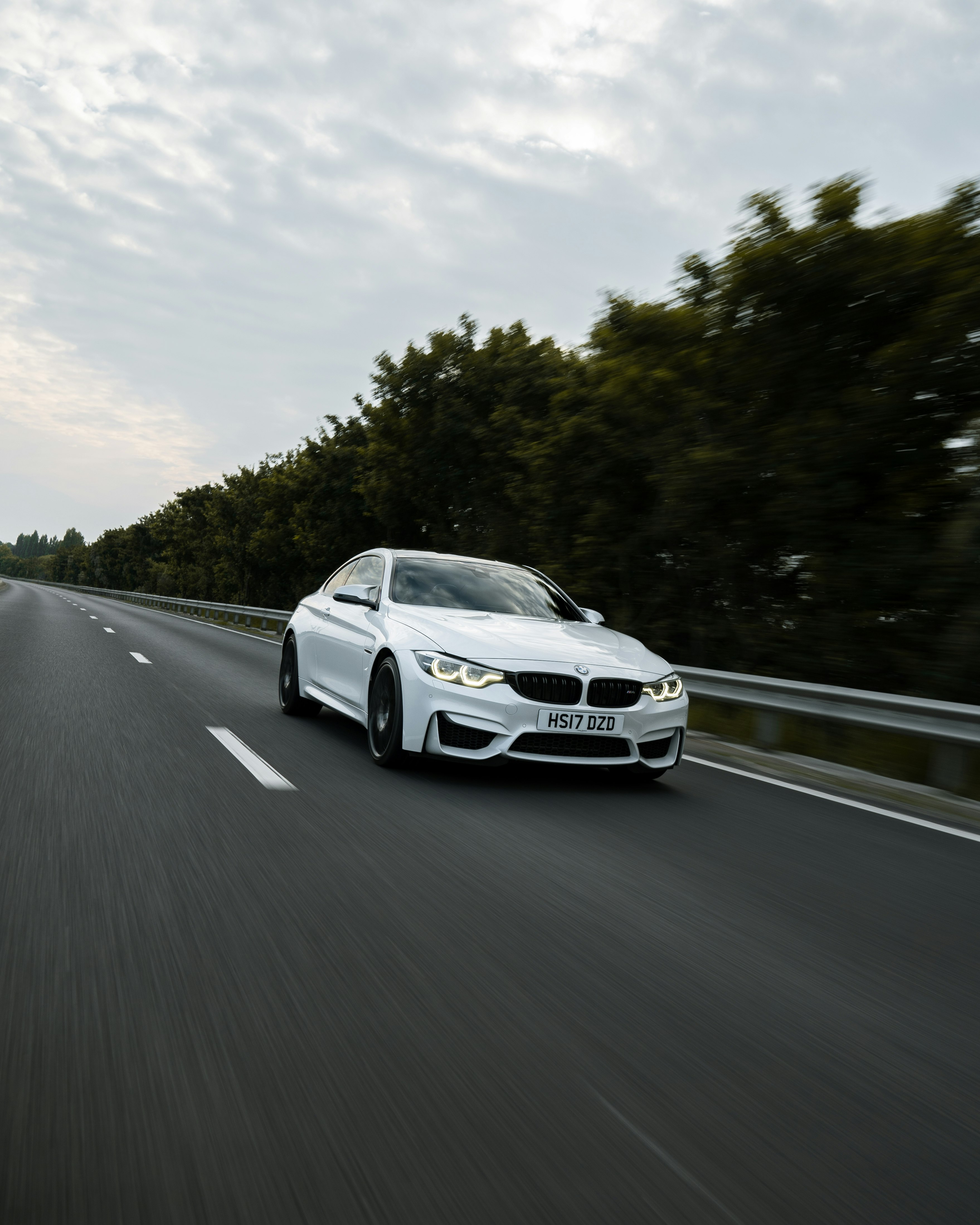 white mercedes benz coupe on road during daytime