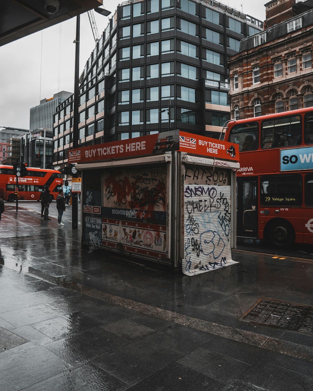 red double decker bus on road during daytime