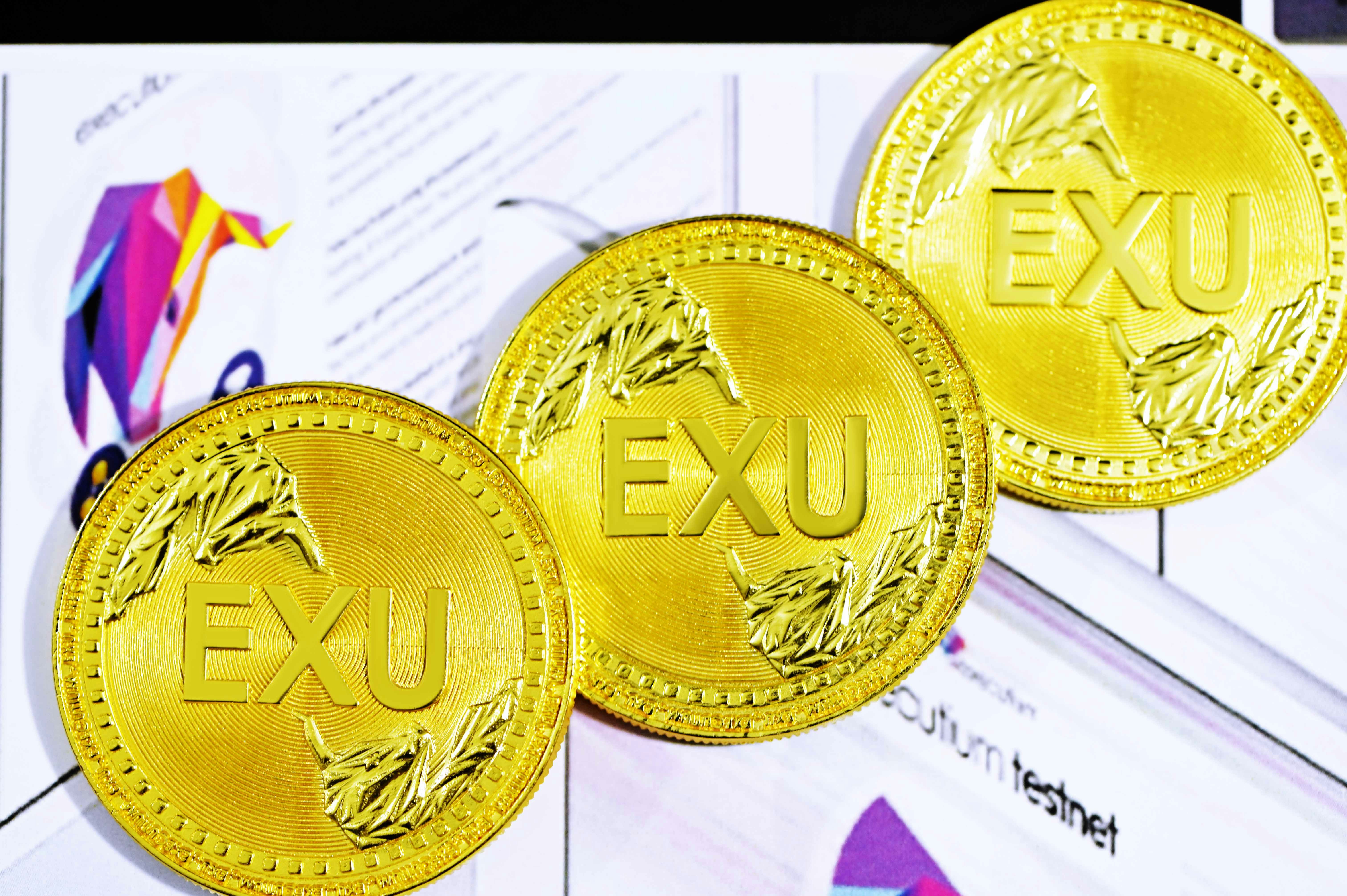 gold round coin on white paper