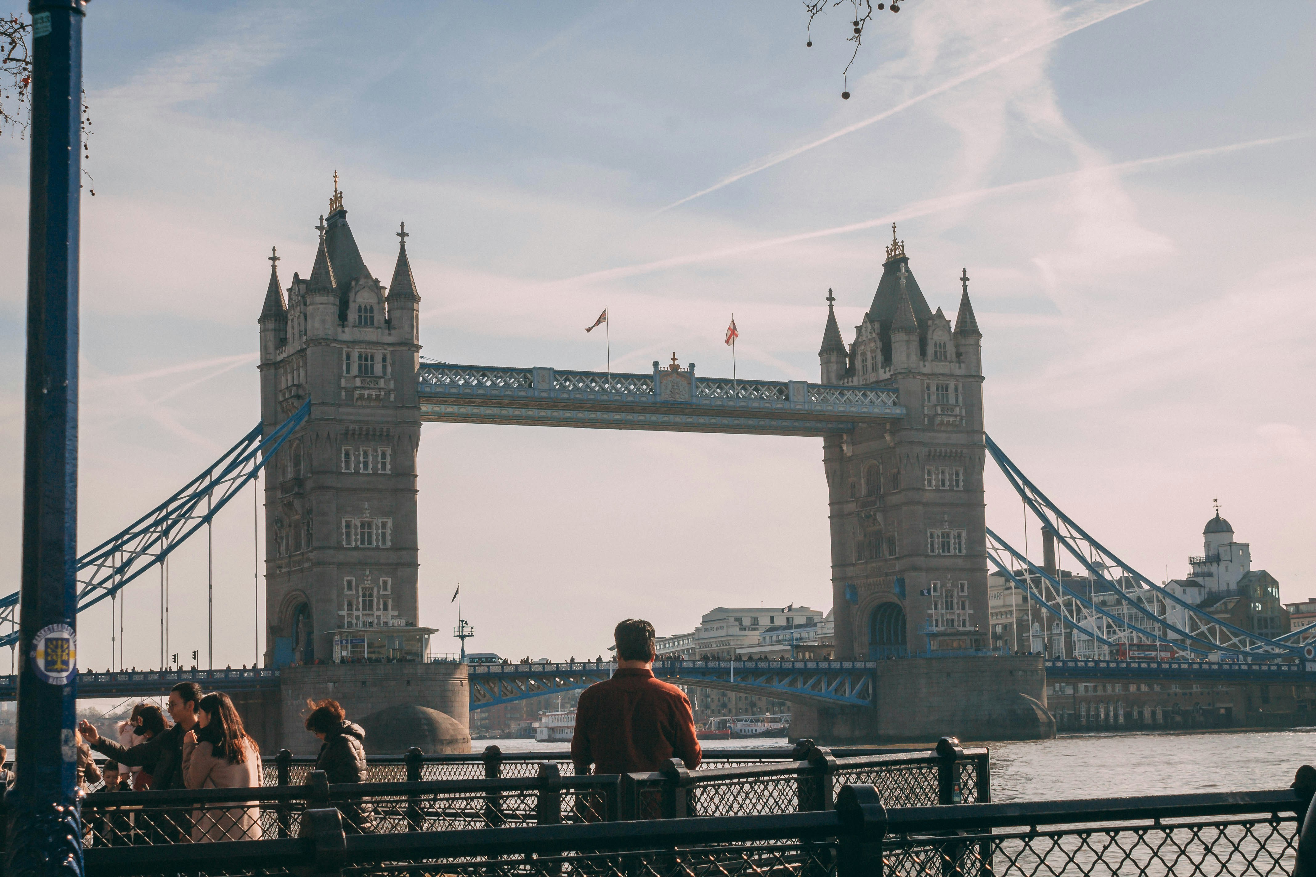 people walking on bridge during daytime