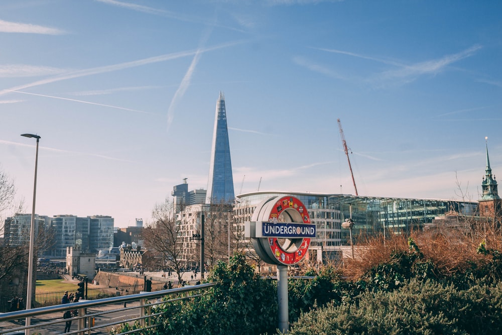 a street sign in front of a cityscape