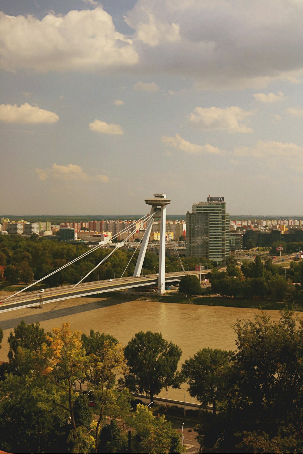 white bridge over body of water during daytime