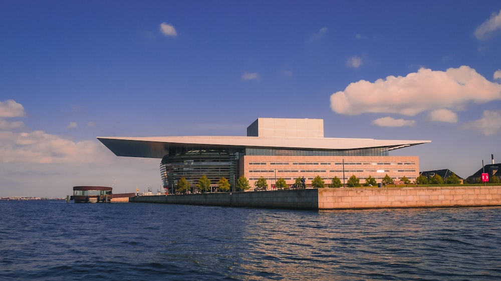 brown concrete building near body of water during daytime