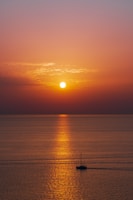 body of water during sunset