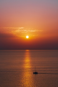 body of water during sunset