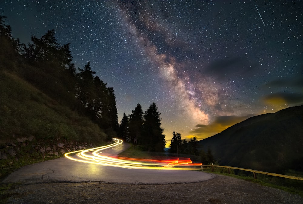 time lapse photography of road during night time