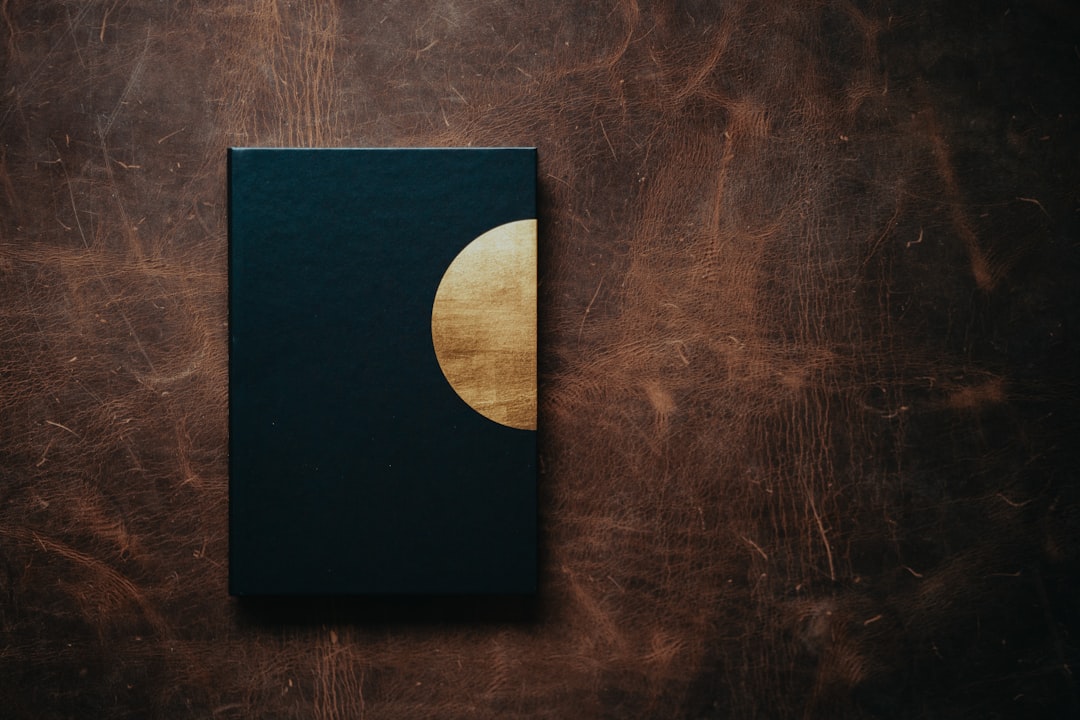 black square box on brown wooden table