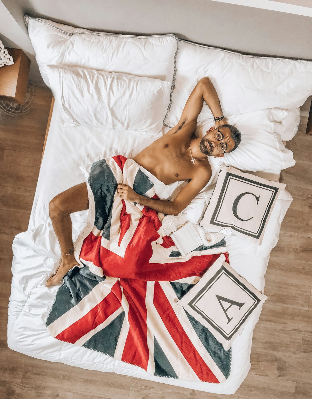 woman in red and white dress lying on bed