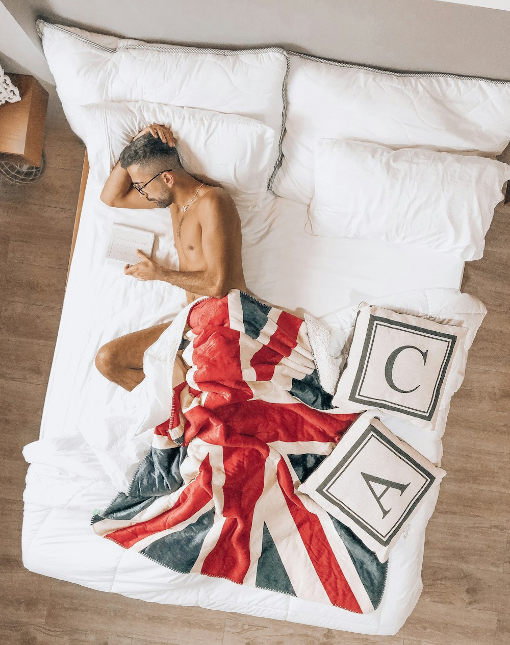 topless woman lying on bed