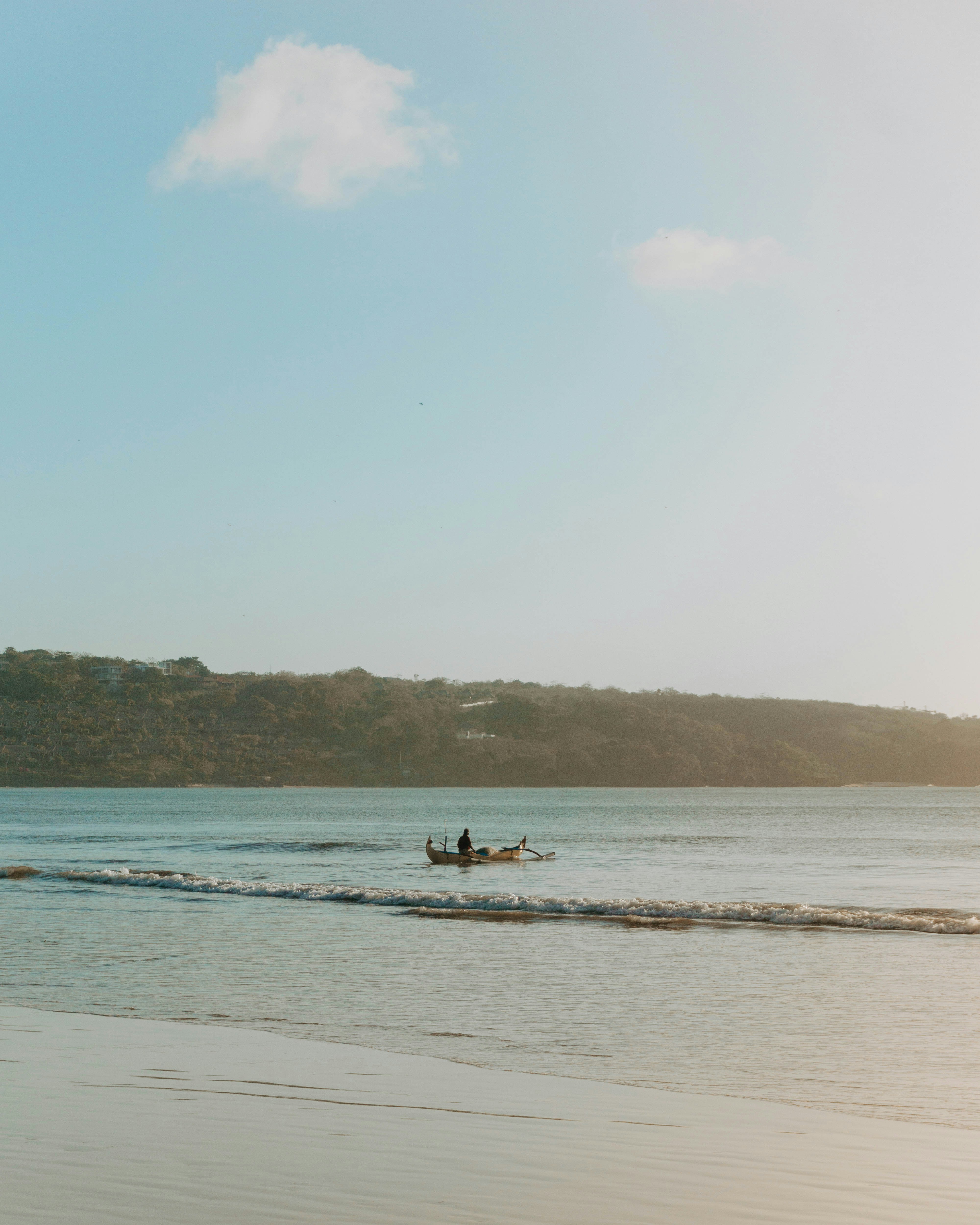 people riding on boat on sea during daytime