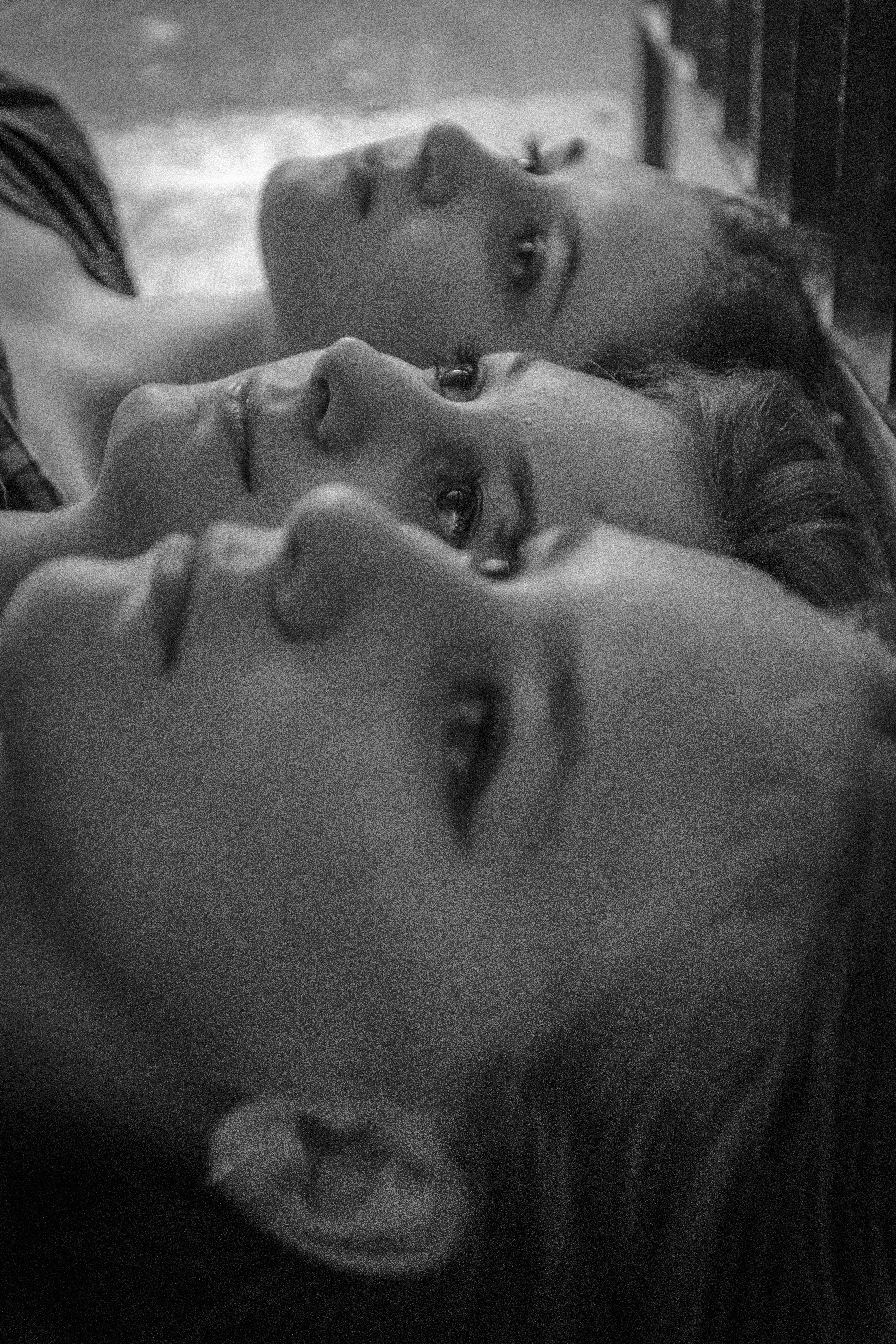 Grayscale photo of woman lying on bed photo Free Beautiful girl photo