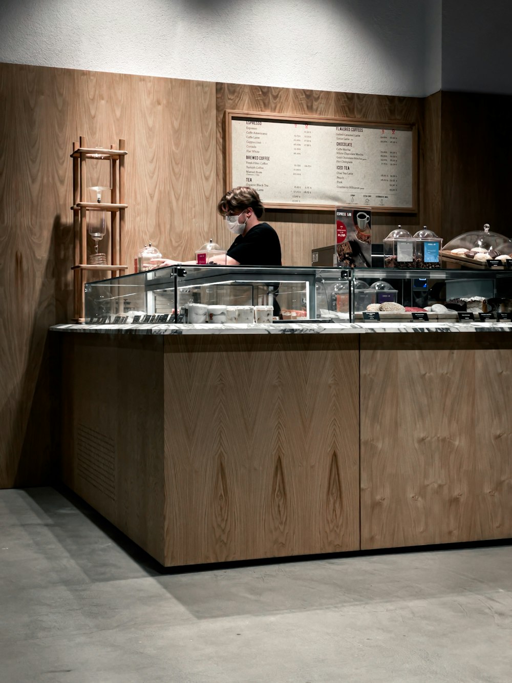 man in black jacket sitting at the kitchen