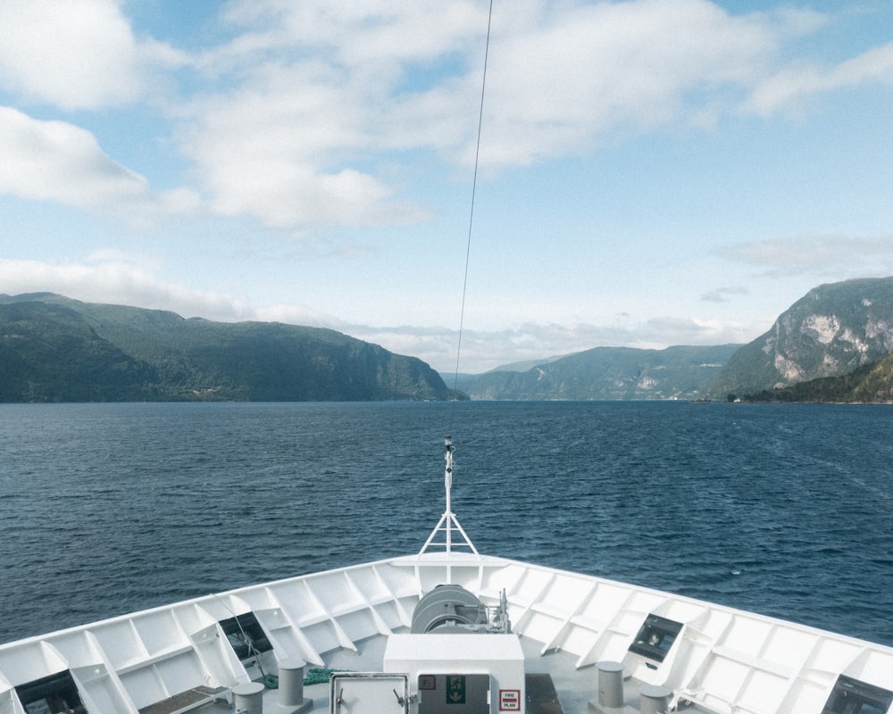 white boat on sea during daytime