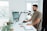 A satisfied customer using Verdure Ridge's automation tools in an office setting.