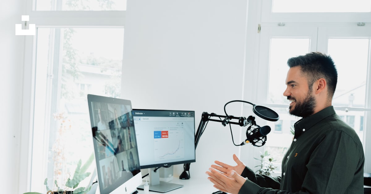 Man in black jacket holding black corded computer mouse photo – Free Video call Image on Unsplash