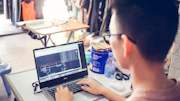 person using black laptop computer