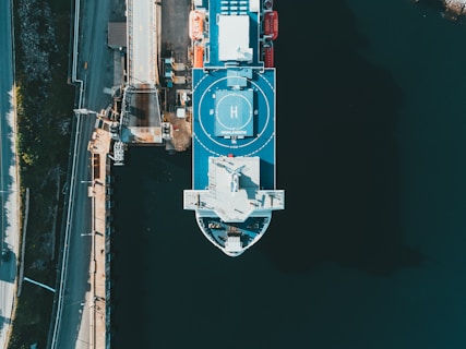 blue and white ship on sea during night time