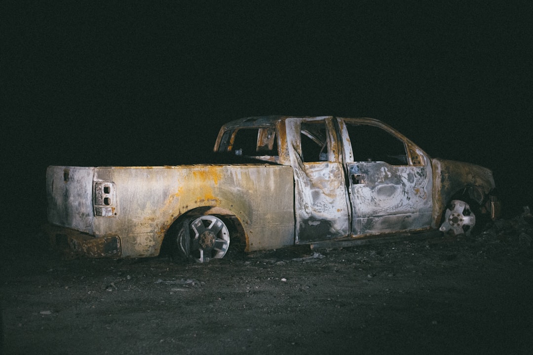 white station wagon on black soil