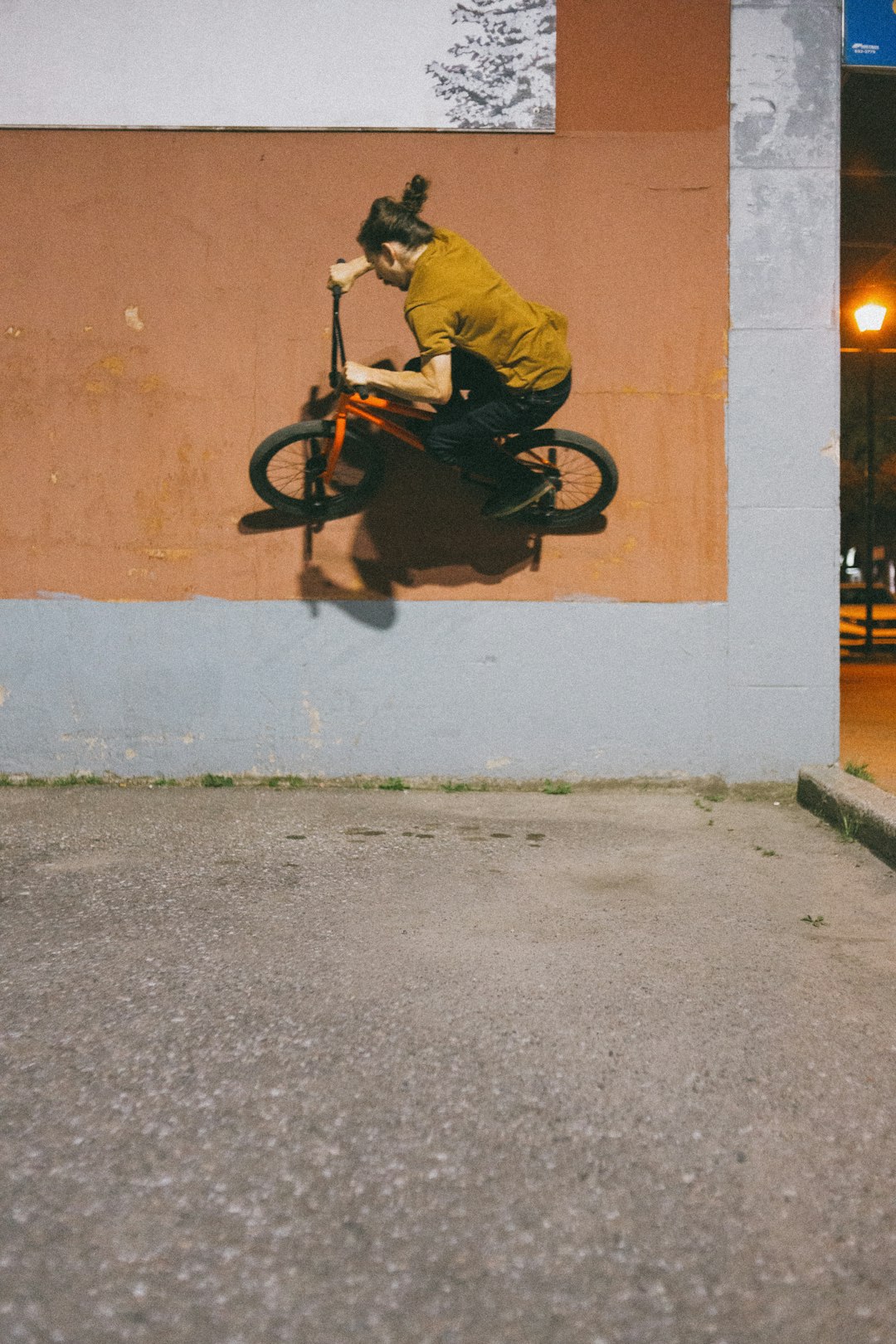 man in yellow jacket riding black motorcycle