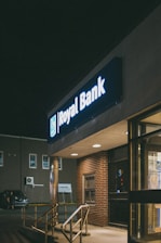 a royal bank sign is lit up at night