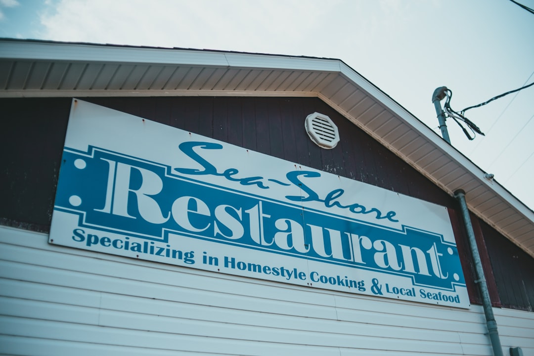 blue and white wooden signage