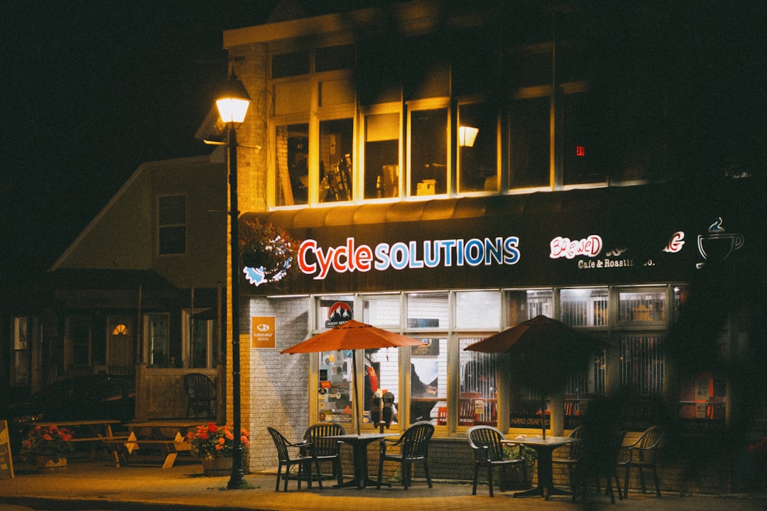 people sitting on bench near building during night time