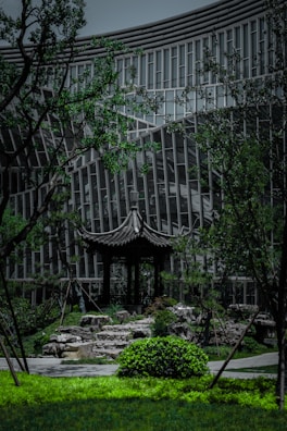 An open-air pavilion with clean lines blending seamlessly into a wooded landscape.