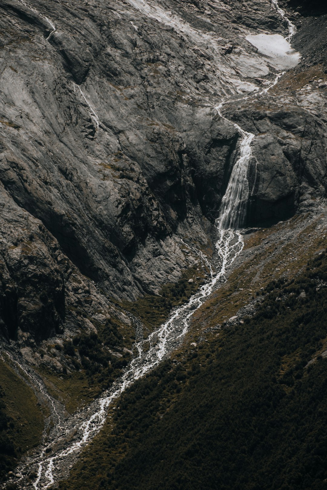 water falls on rocky mountain