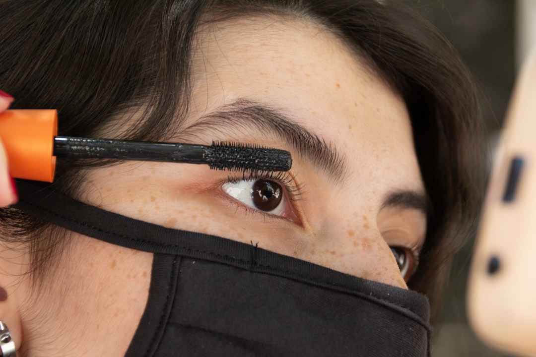 woman in black shirt with black eye shadow,
