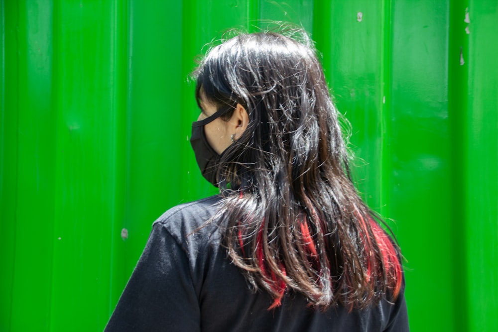 woman in black long sleeve shirt wearing black sunglasses