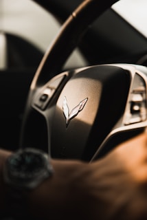 black and silver car steering wheel