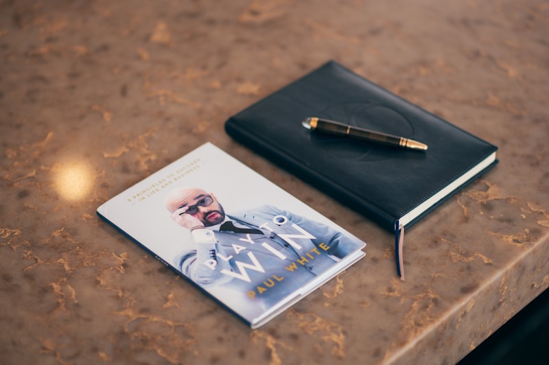 Executive's pen on business notepad