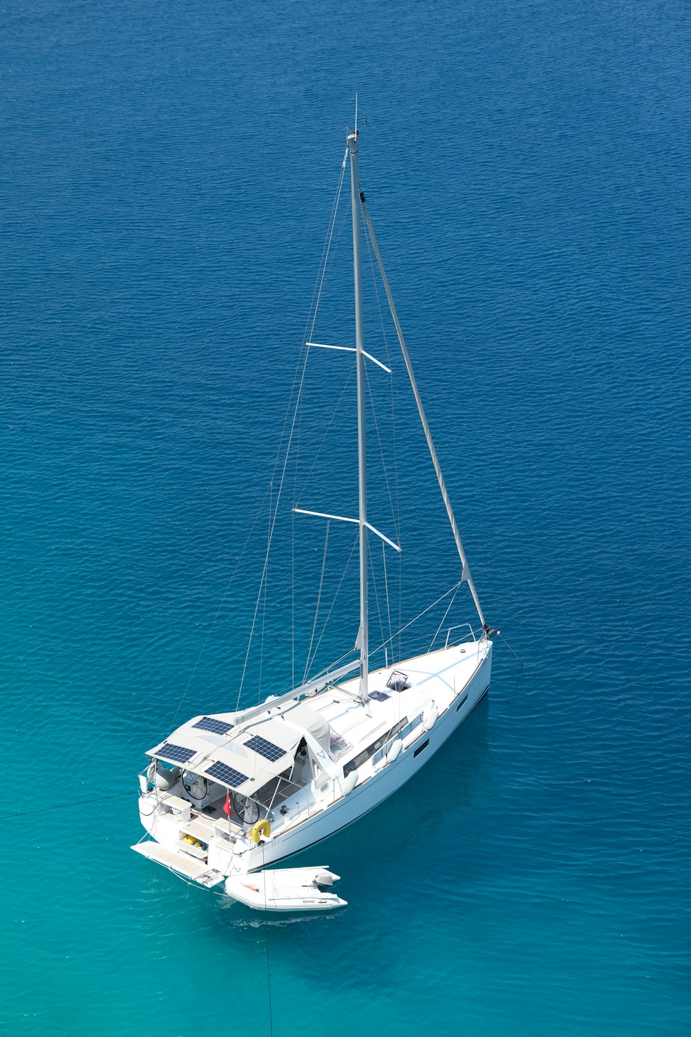 white and black boat on blue sea during daytime