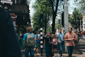 A group of happy tourists exploring a vibrant city street.