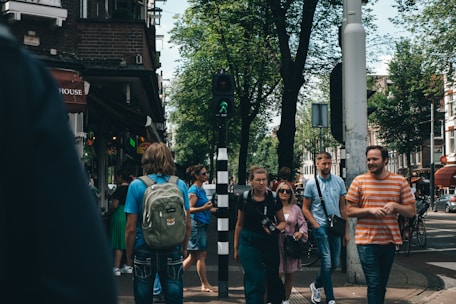 A group of happy tourists exploring a vibrant city street.