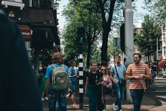 Group of happy tourists exploring a vibrant city street.