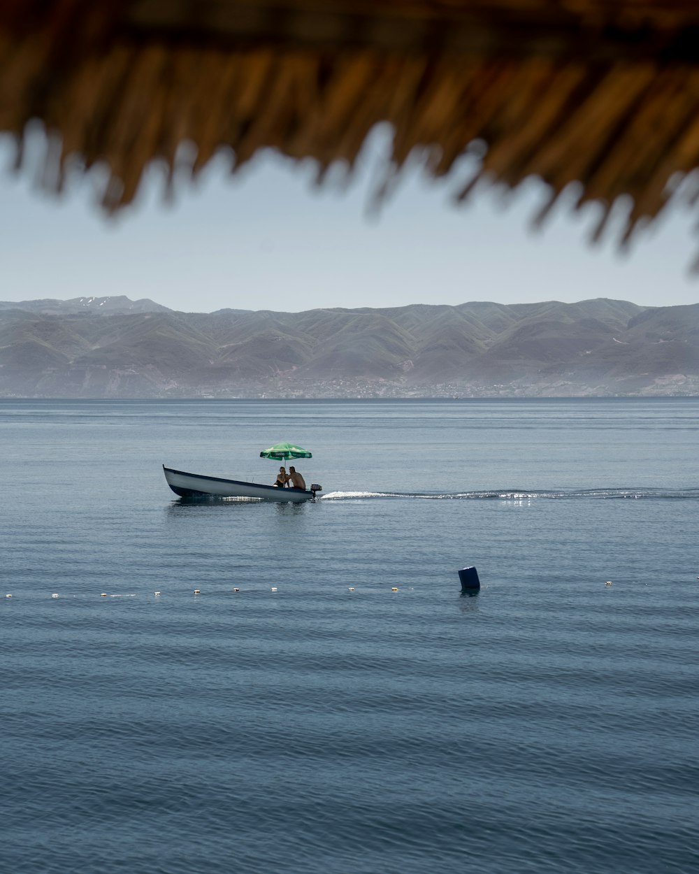 man in green kayak on sea during daytime