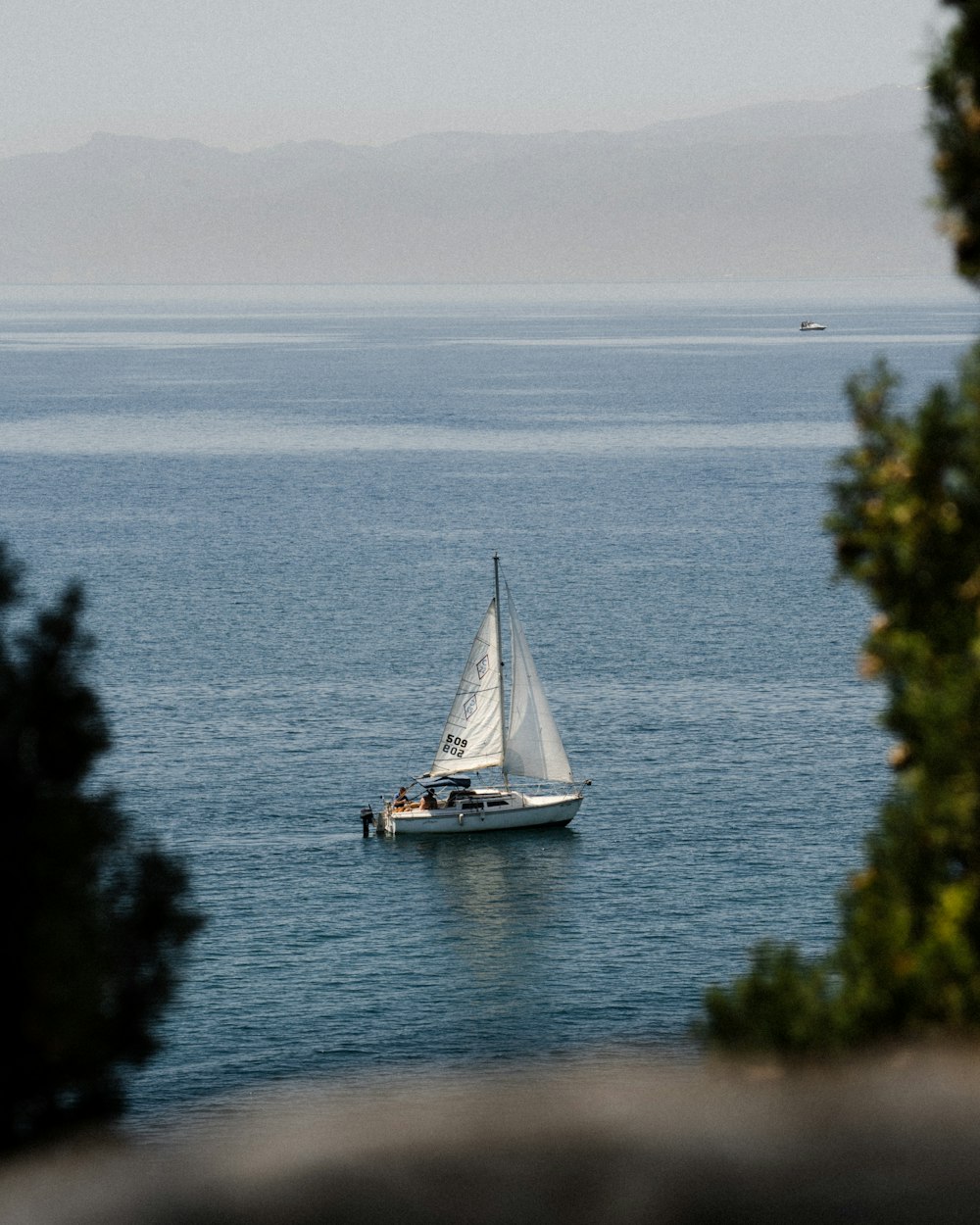 white sailboat on sea during daytime