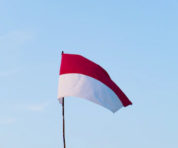 Poland red and white flag on pole during daytime