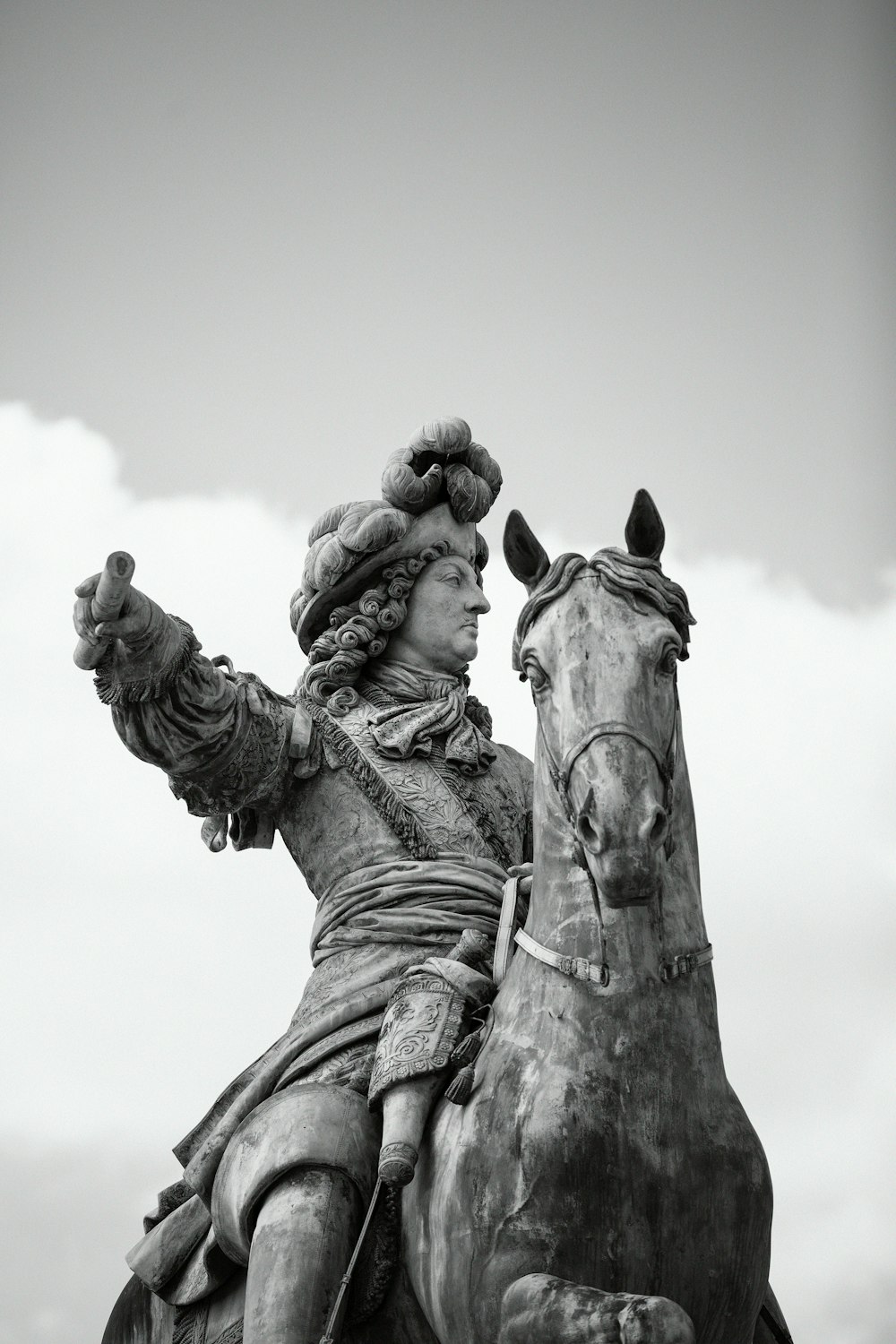 grayscale photo of man statue