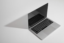 macbook pro on white table