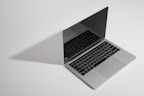 macbook pro on white table