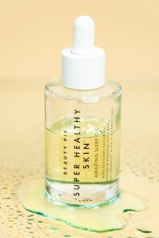 clear glass bottle on white table